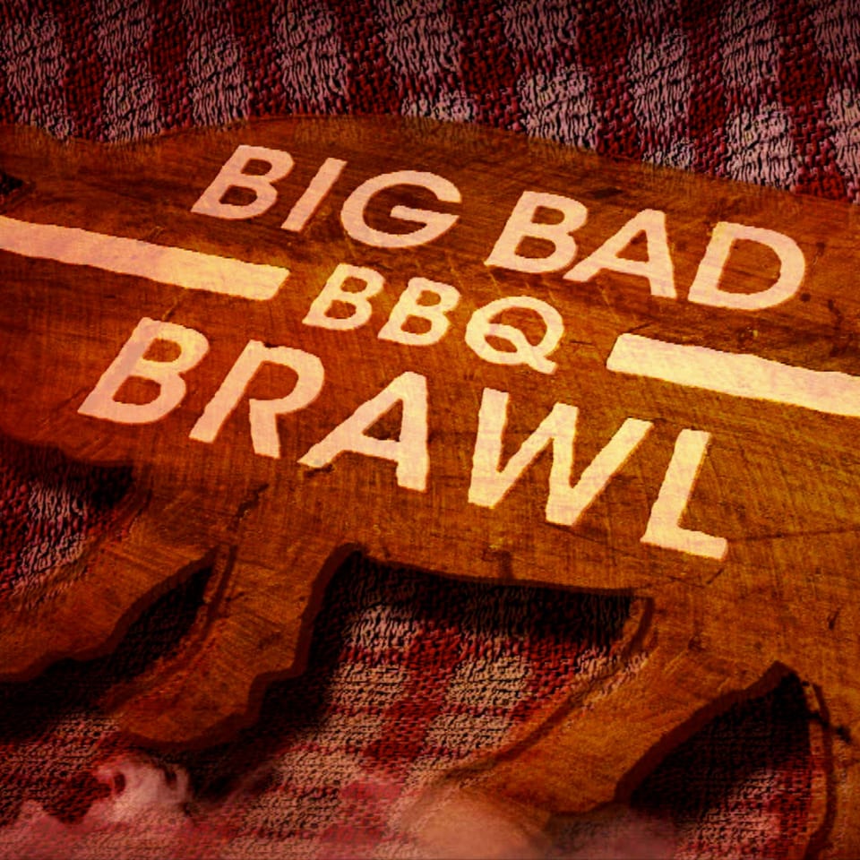 A wooden cutting board shaped like a bull with "BIG BAD BBQ BRAWL" carved into it.